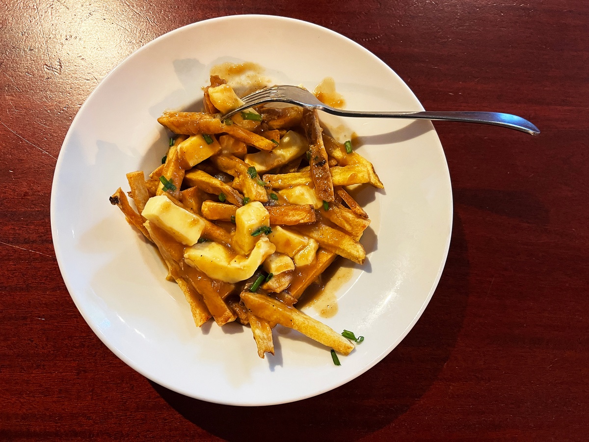 Quebec-style poutine with fries, cheese curds and brown gravy served at the Canadian Embassy Pub in Paris