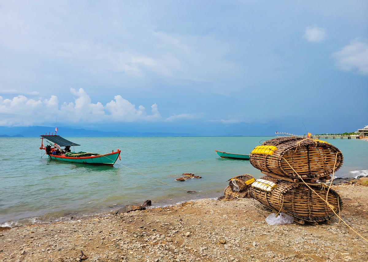 Traditional fishing boats and bamboo crab traps near Kep Crab Market, Cambodia