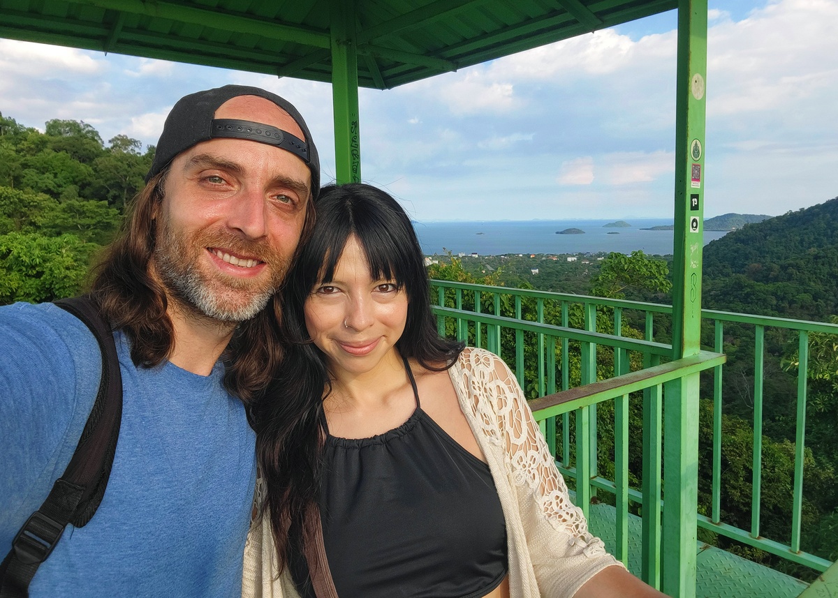 Selfie of a couple (Maxime Boudrias and Ericka Cordero) at the top of the observation tower in Kep National Park, Cambodia