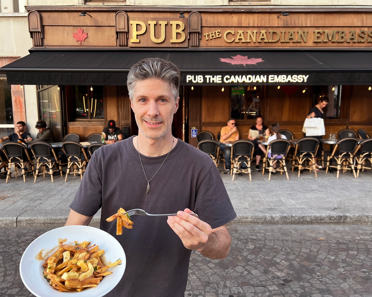 Front of the Canadian Embassy Pub in Paris with a Quebec-style poutine