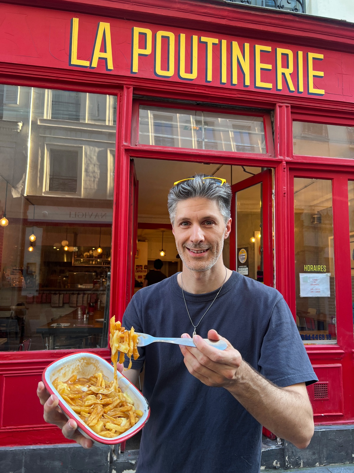 Front of La Poutinerie in Paris with a French-style poutine