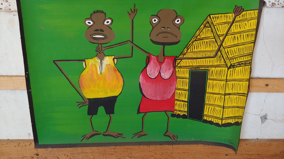 Artistic painting in the rebel village of Los Rabelados: a woman holding a man by the neck